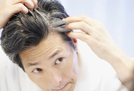 photolibrary_rf_photo_of_man_looking_at_gray_hair_thumb