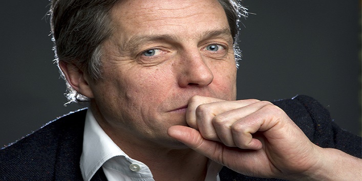 Actor Hugh Grant poses for a portrait as he promotes his movie “The Rewrite” in the Manhattan borough of New York